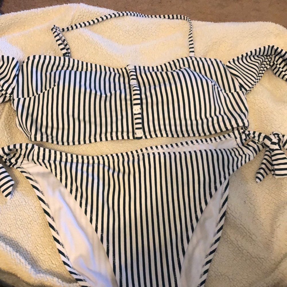 Two piece bathing suit with ties on the arms